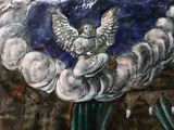 a painting of an angel on the side of a building
