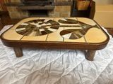 a coffee table with a mosaic design on top of it