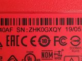 a close up of a label on the side of a red machine