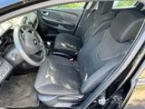 the interior of a car with a steering wheel and a dashboard