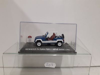 a miniature car in a clear display case on a table