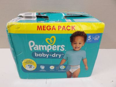 a box of diapers on a table with a baby in it