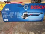 boxed box of bosch power tools on a table in a garage