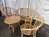 four chairs and a table that are sitting on the floor
