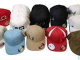 a lot of hats that are all different colors and sizes