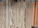 a lot of books that are stacked on a shelf