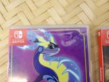 two nintendo switch games sitting on a table