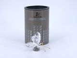 a close up of a tin of silver crystal next to a pin