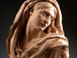 a statue of a woman with a veil on her head