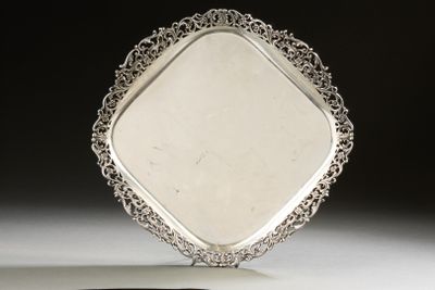 an image of a silver plate with a decorative design on it