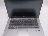 a laptop computer sitting on a table with a mouse