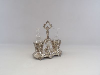 an image of a silver plated candle holder on a white surface