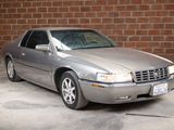 a picture of a silver car parked in a parking lot