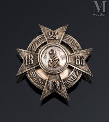 an image of a silver medal with a star on it