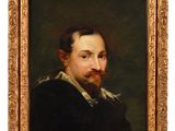 un tableau représentant un homme barbu dans un cadre en or