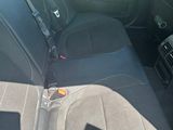 a car with a seat belt in the back of it