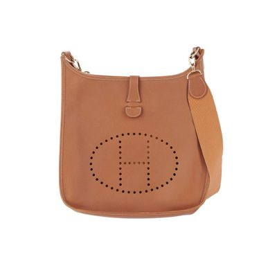 a brown leather handbag with a logo on the front