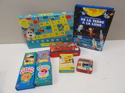 several children ' s board games are sitting on a white table