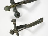 pair of antique iron door handles on a white background