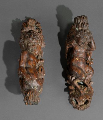 pair of carved wood figures of a man and a woman