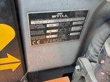 a close up of a yellow and black sign on the side of a motorcycle