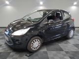 a picture of a small black car parked in a garage