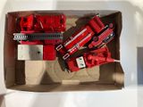 a box with a bunch of toy firetrucks in it
