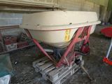 a white boat sitting on top of a wooden pallet