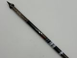 a close up of a pen on a table with a white background