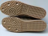two pairs of shoes are shown on a white surface