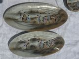 two spoons that are sitting on a table