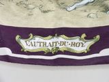 a close up of a purple and white scarf with a horse on it