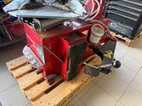 a machine that is sitting on a pallet in a garage