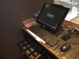 a desk with a laptop and a keyboard on it