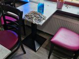 a table and chairs in the corner of the room