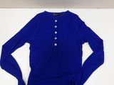 a blue shirt sitting on top of a white table