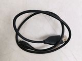 a close up of a black usb cable connected to a phone