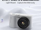 a camera that is sitting on a white surface
