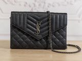 saint laurent black quilted leather clutch bag with chain strap