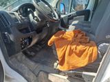 an image of a car with a towel in the passenger seat