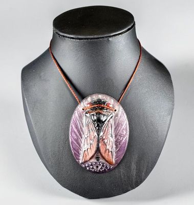 a close up of a necklace on a mannequin on a mannequin