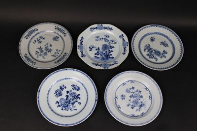 six blue and white plates with floral designs on them on a table