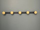 a close up of a wall mounted light fixture on a gray wall