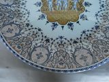 a plate with a design on it sitting on a table