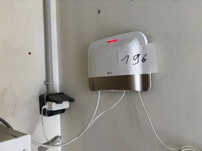 an image of a bathroom with a clock on the wall
