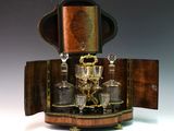 a wooden case with a glass set on top of it