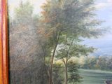 une image d'un tableau sur le mur d'une pièce