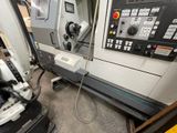 a machine that is sitting in a room with a lot of machines