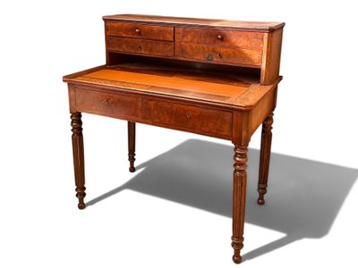 a small wooden desk with a drawer on top of it