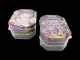 two tins that are sitting next to each other on a table